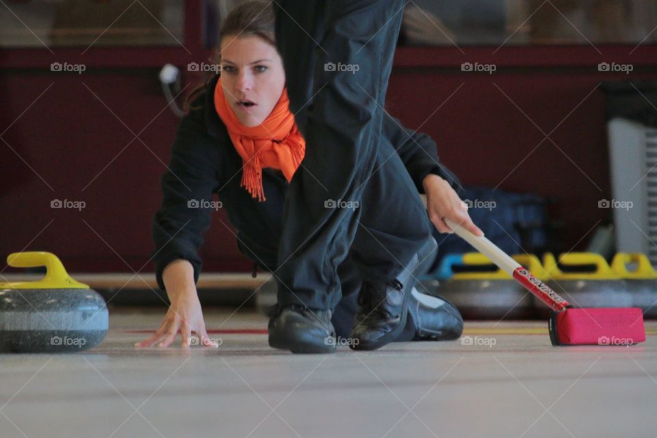 Curling. Female curling player 