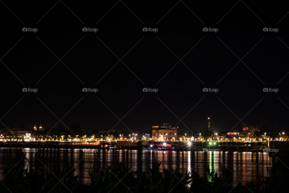 Beautiful reflection of night light on surface  of Nile river