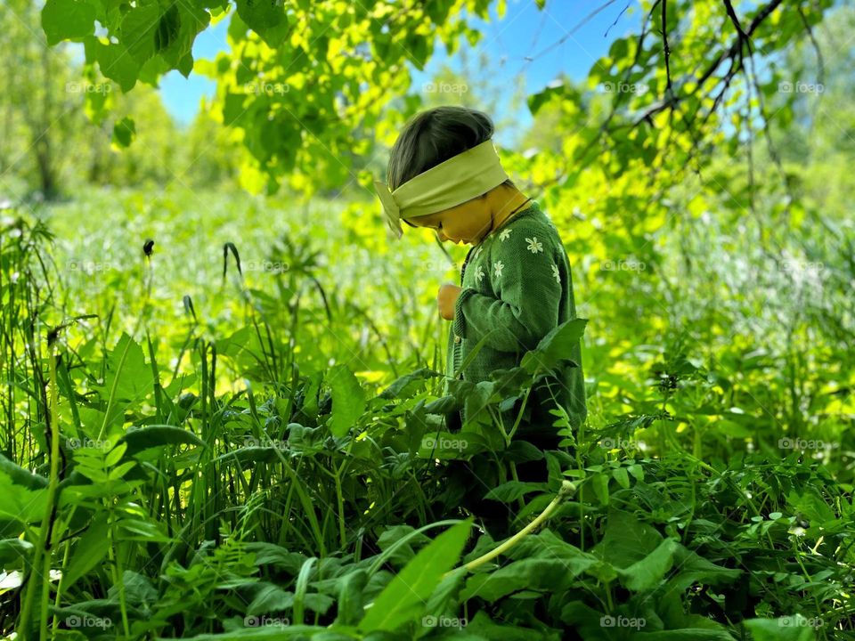 A little girl in the magical forest 