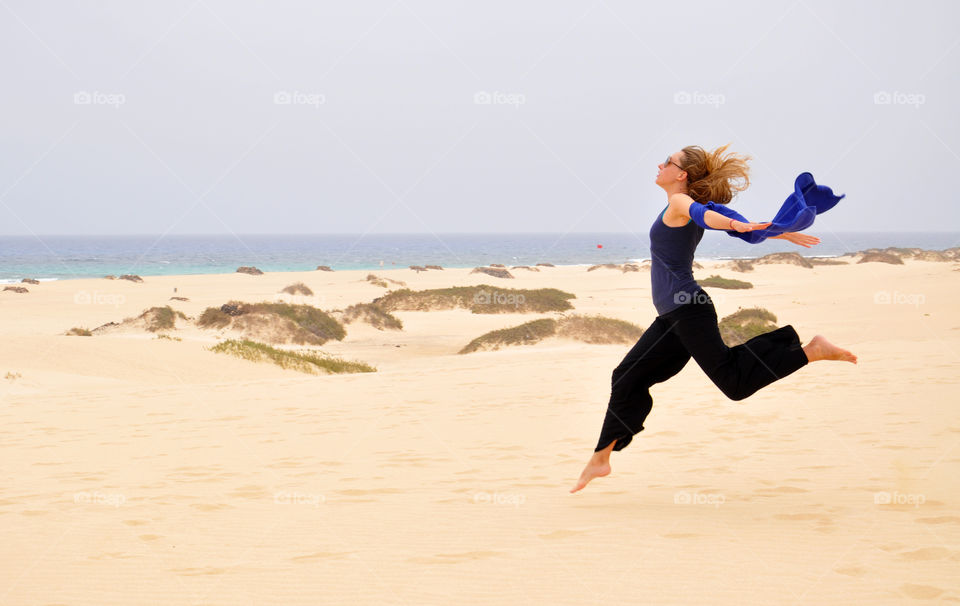 dunes and the ocean. jumping and flying