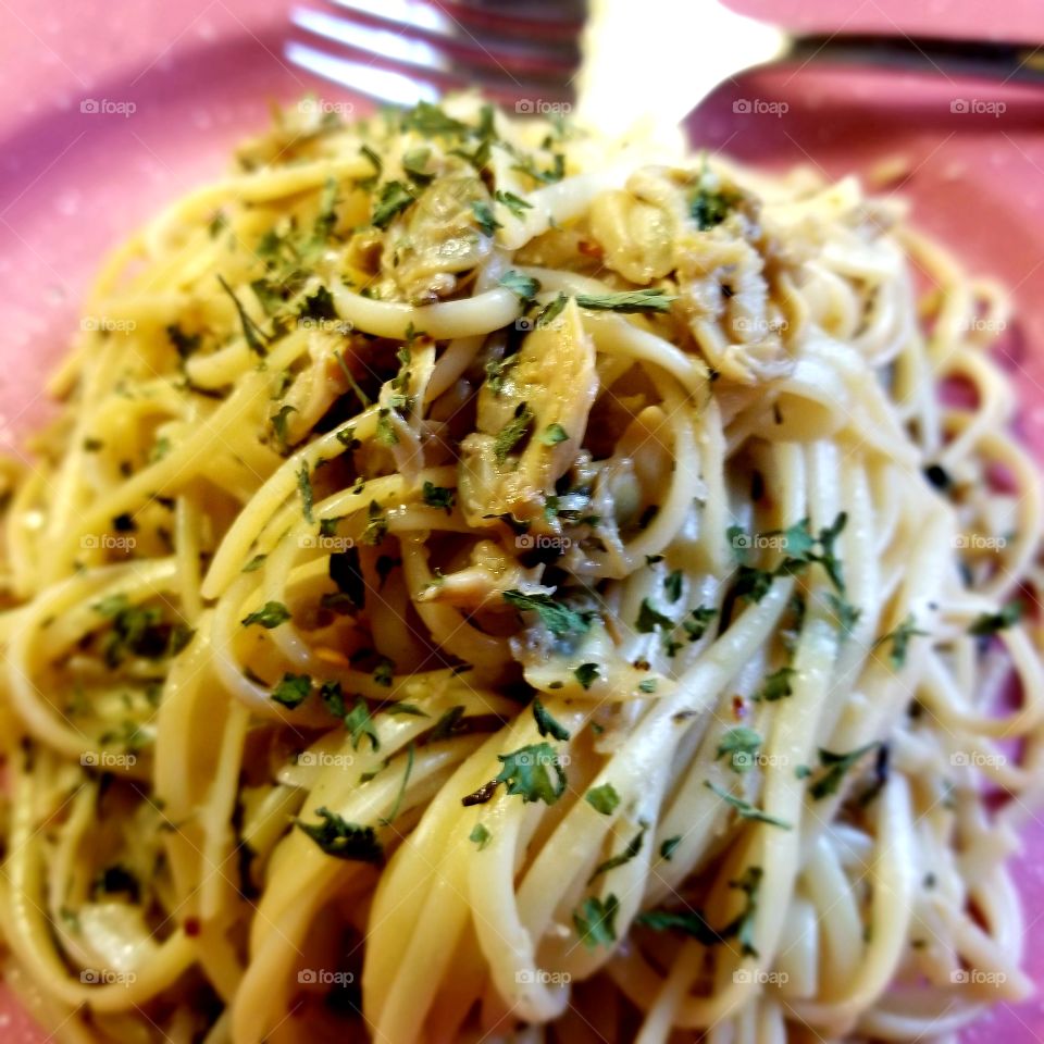 Home made clam fettuccine. I love making pasta. It's my family's comfort food. This one had anchovy, made it more savory.
