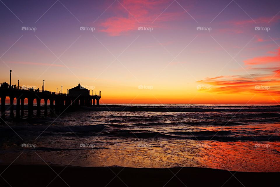 Tourist on pier during sunset