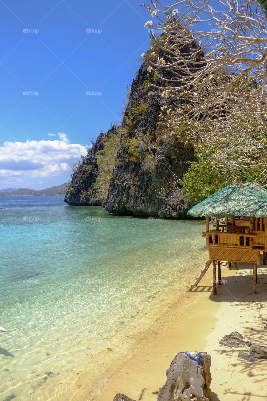 Calming afternoon with the view of crystal clear ocean. A tropical feel when feet touches the sand and the calm wave