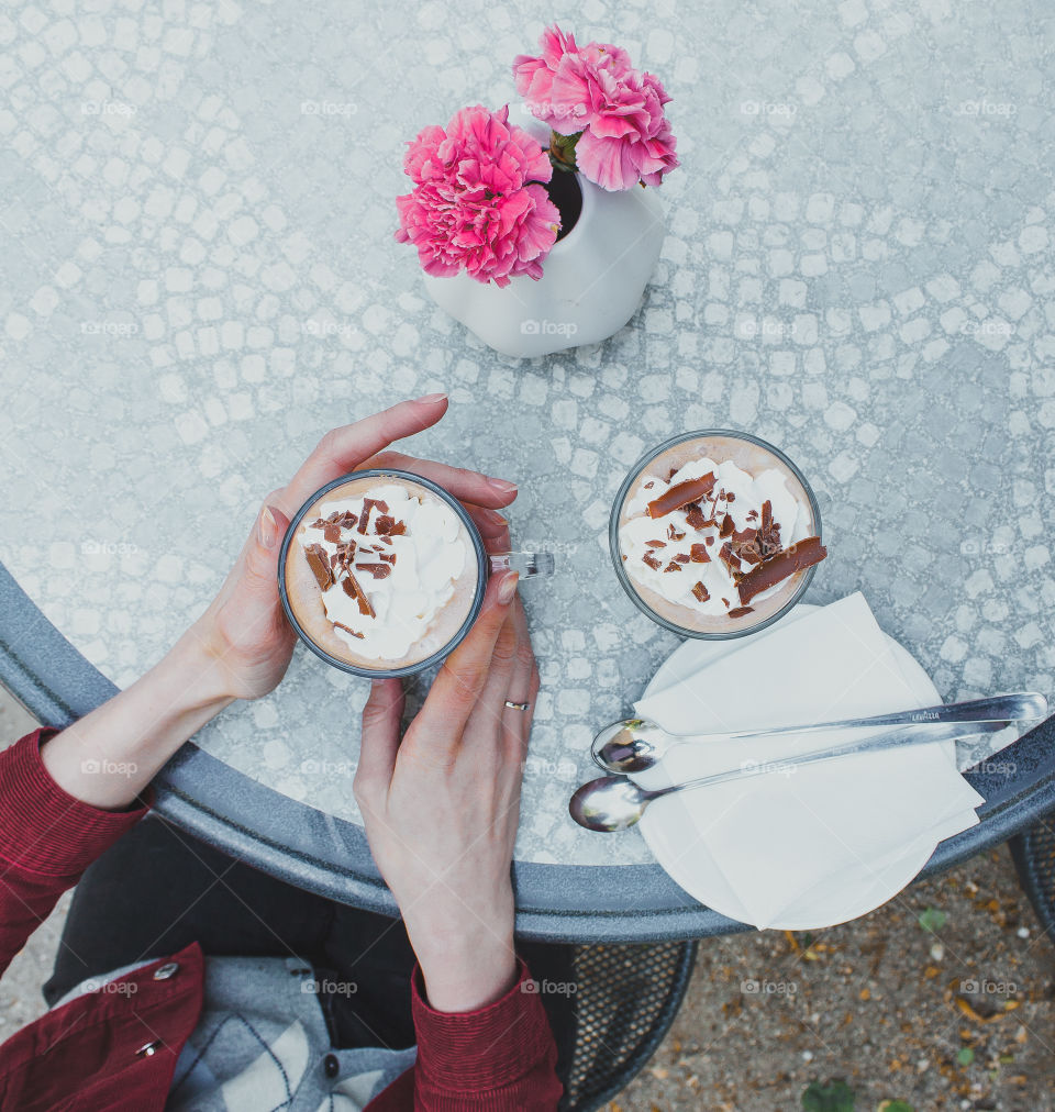 Woman holding coffee with chocolate