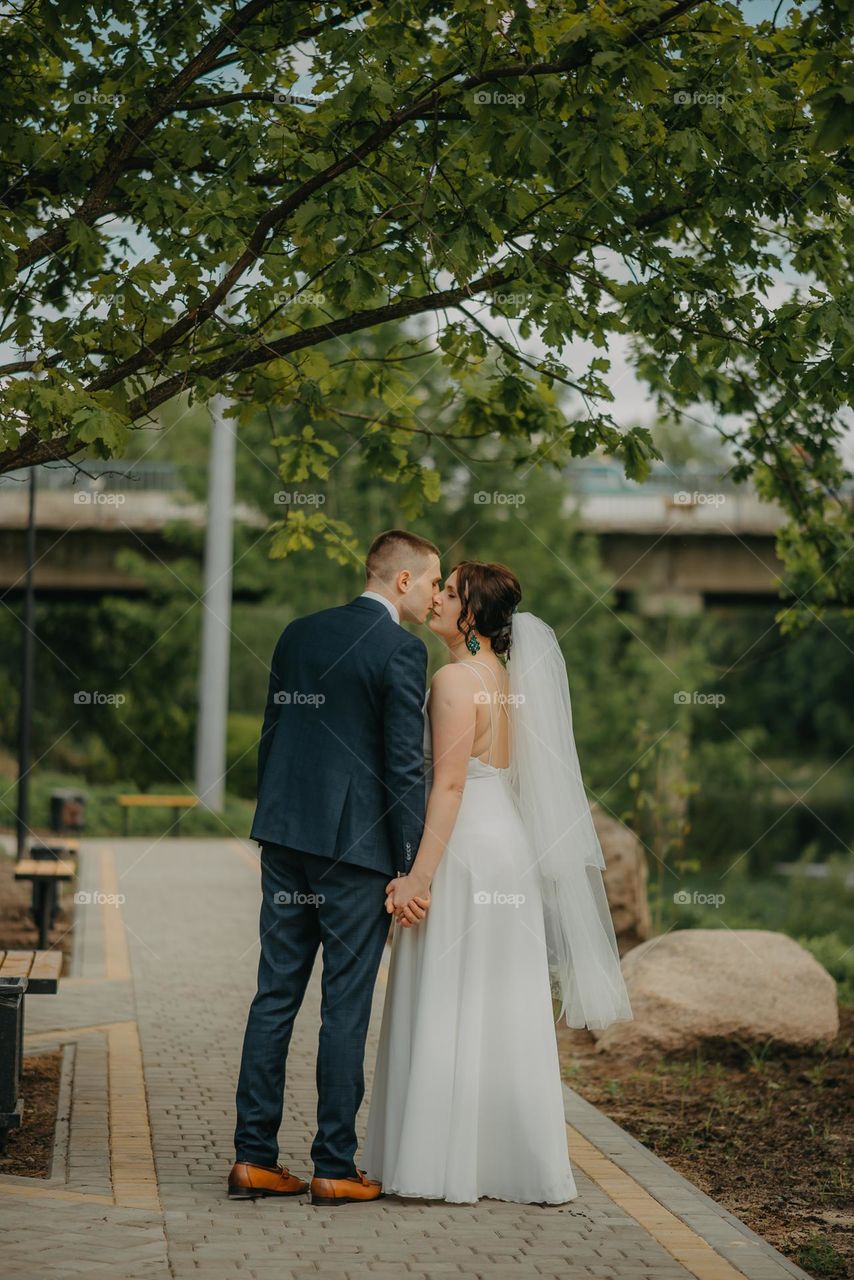 A second before the sweet kiss of the groom and the bride