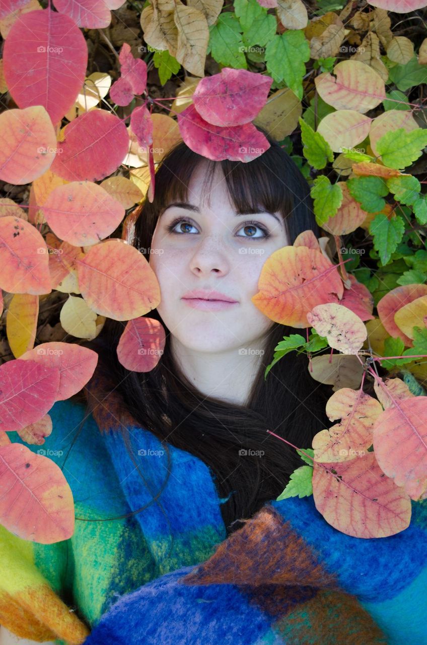 Young Girl on Autumn Background