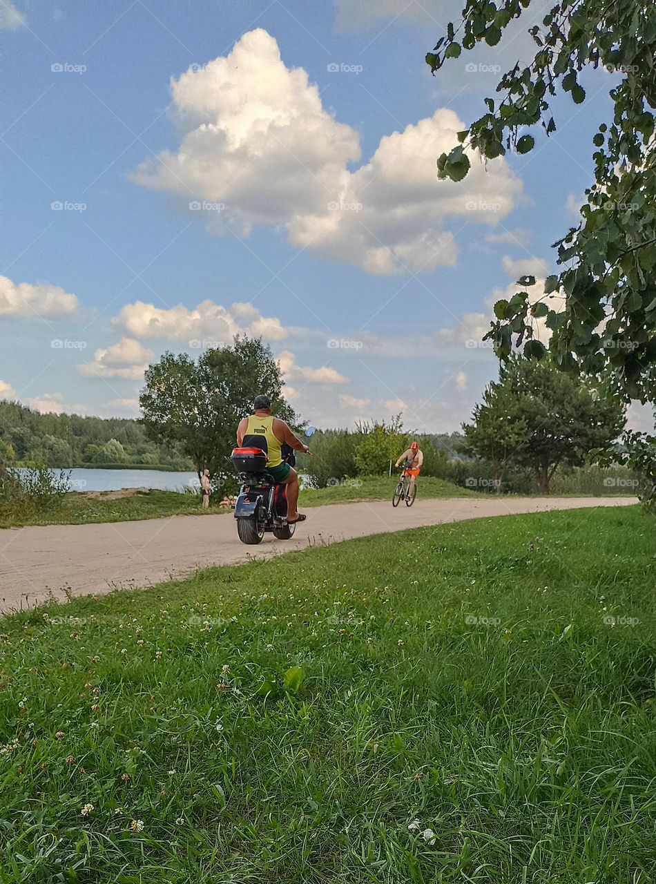 men on a electric scooter, summer time