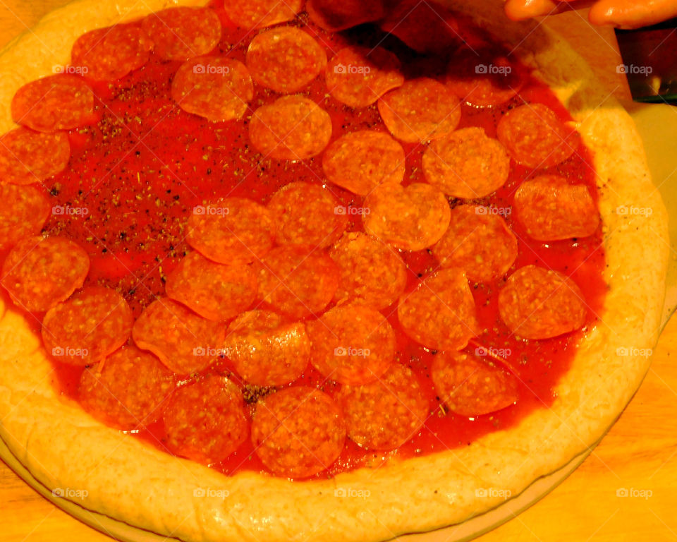 Delicious and nutritious homemade pizza with fresh, colorful vegetables, meats and a variety of spices! Grab a slice!