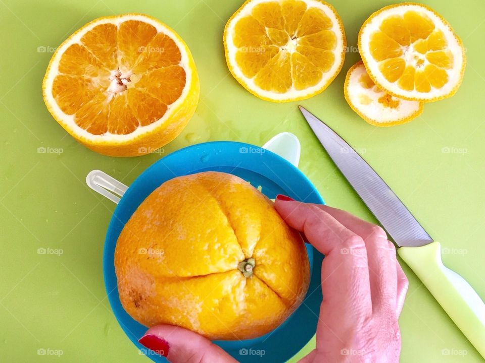 Squeezing Oranges for Juice 