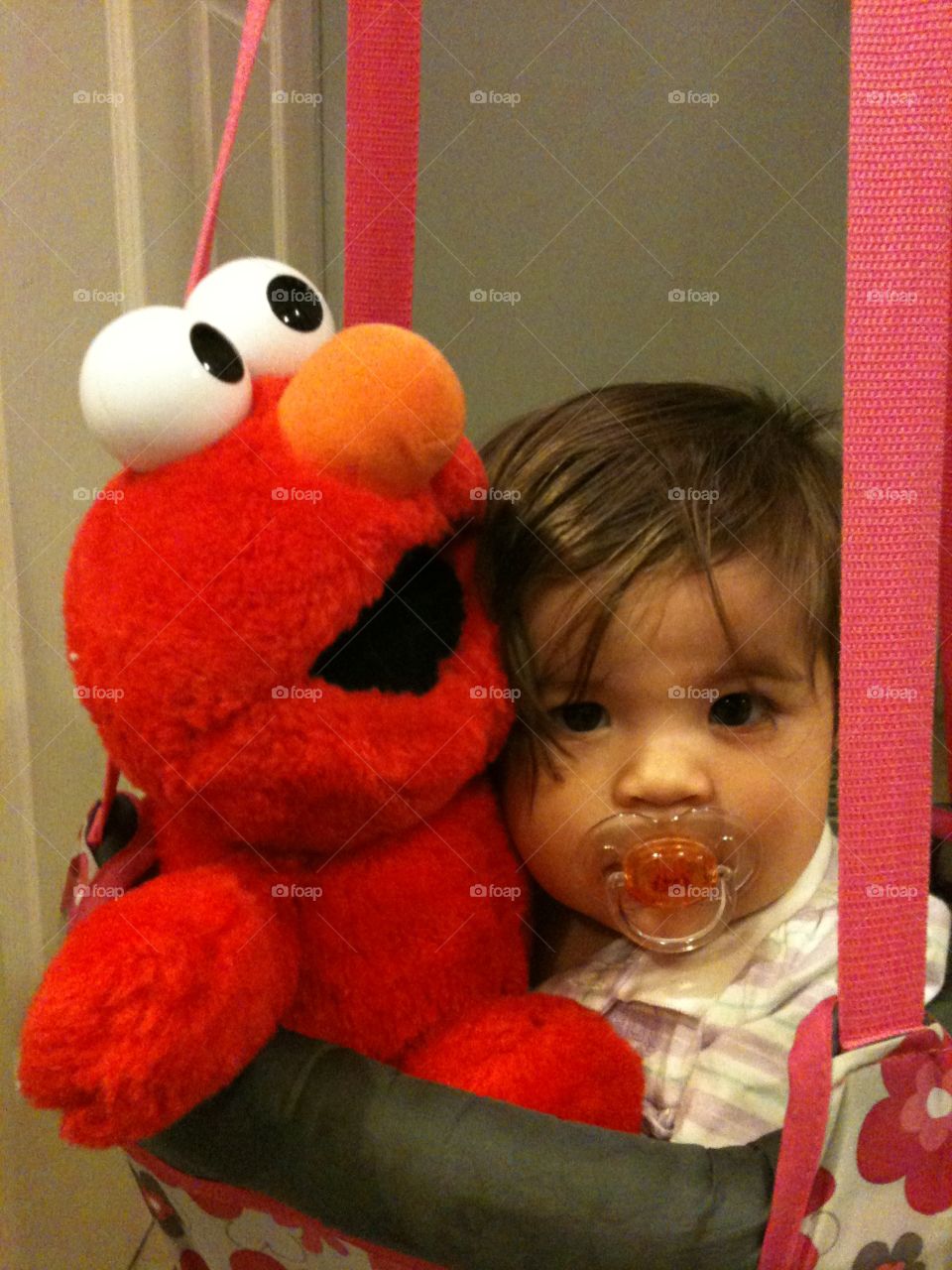 Elmo is my Jumping buddy in my bouncing chair
