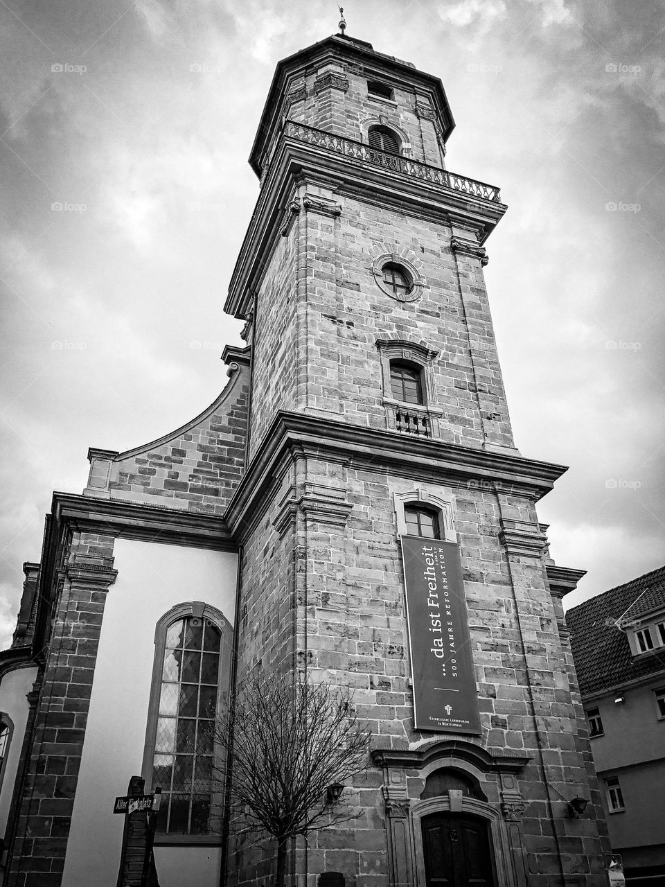 A black and white shot of a German church tower