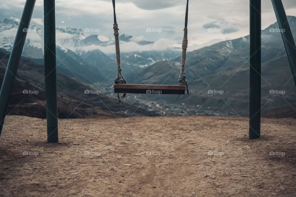 Swing in mountains.  Dreams comcept