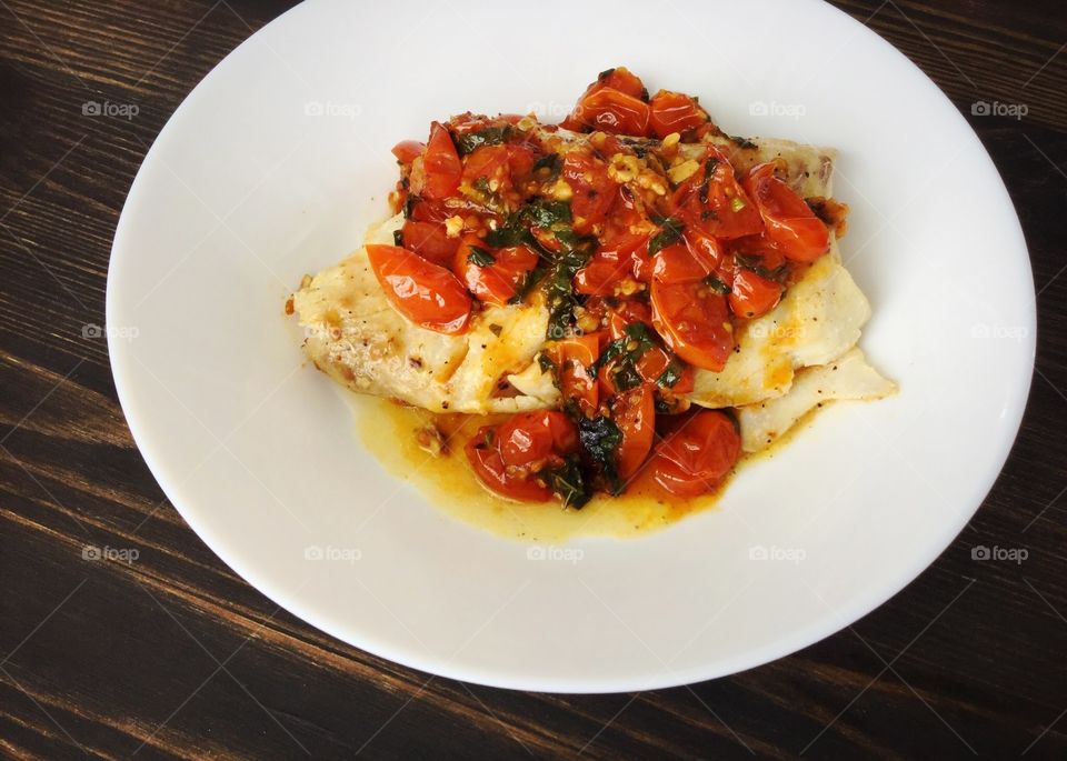 Pan-seared cod with a tomato, basil, and white wine sauce