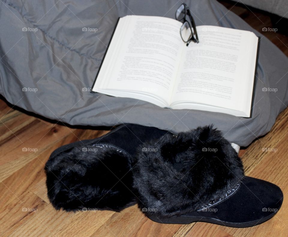 Black Faux Fur Slippers, book, and glasses on blanket