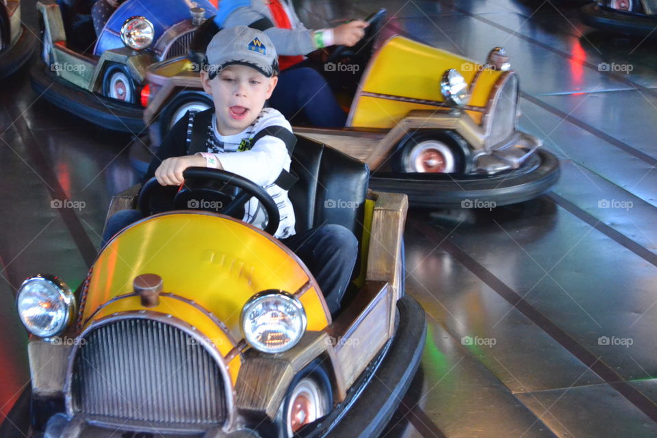 Boy driving a bumper car