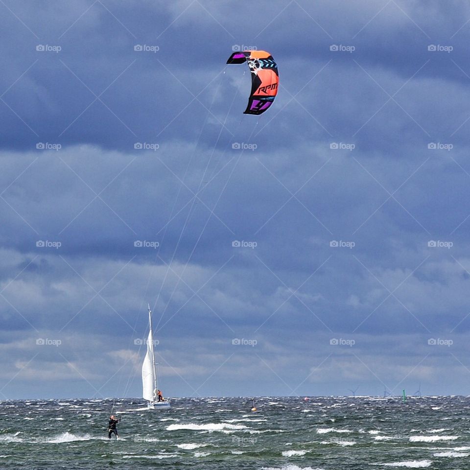 Kite surfer & sailboat