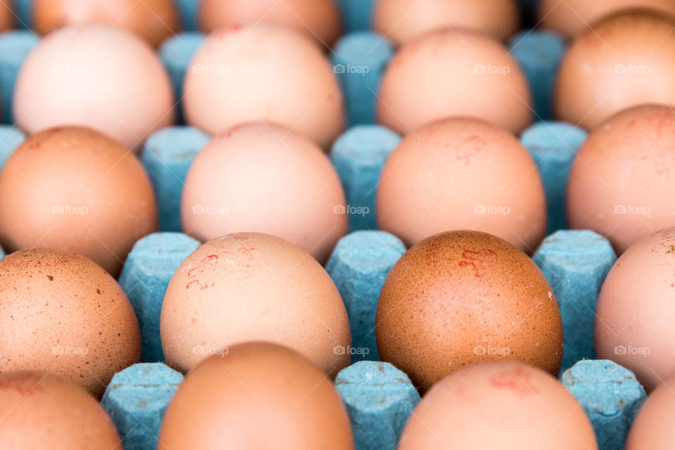 Brown Eggs In Cardboard Box
