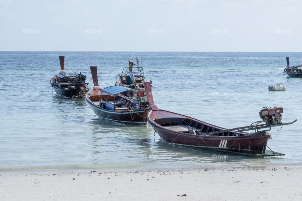 Beautiful travel boat on the beach