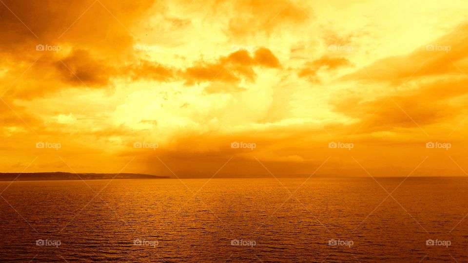 Scenic view of sea against cloudy sky