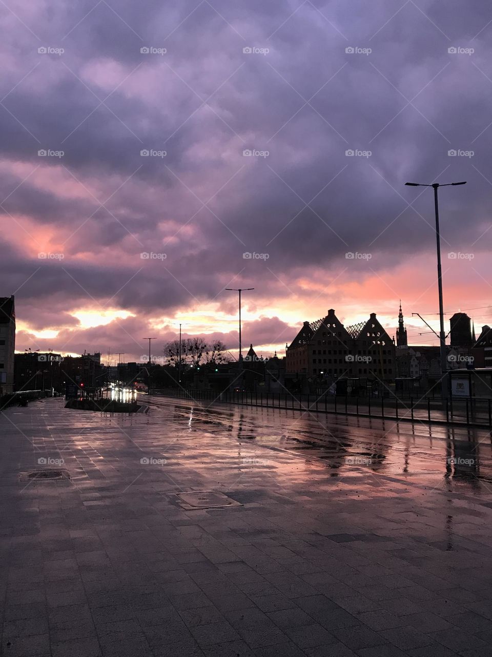 The serene charm of rain - kissed streets and breathtaking purple evening sky. Immerse yourself in the magic of post - rain 😌