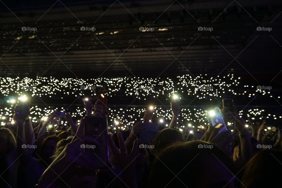 Phones lighting up at a concert 🤍