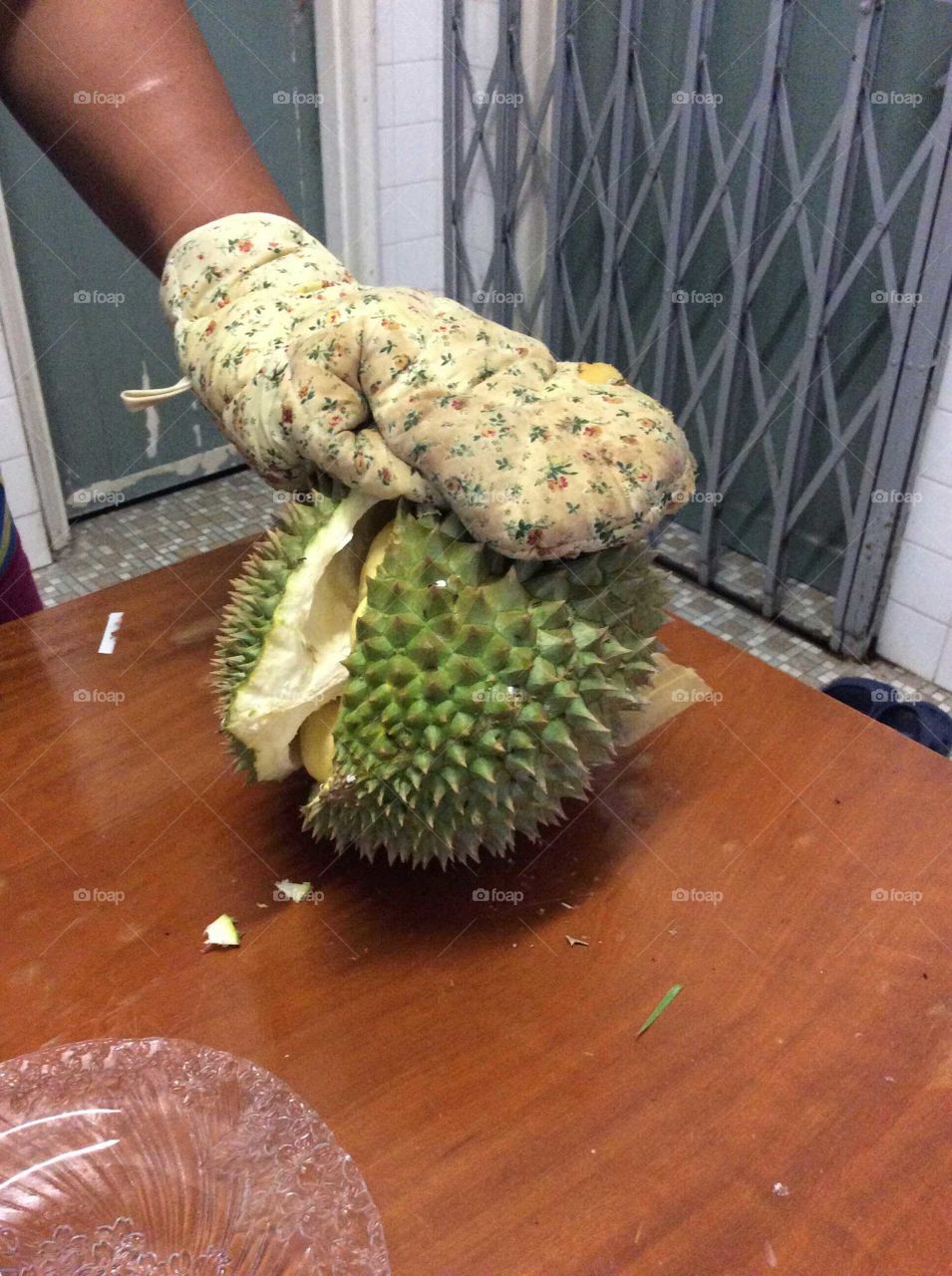 Opening a durian fruit.