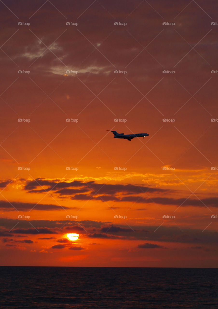 sea sunset and plane