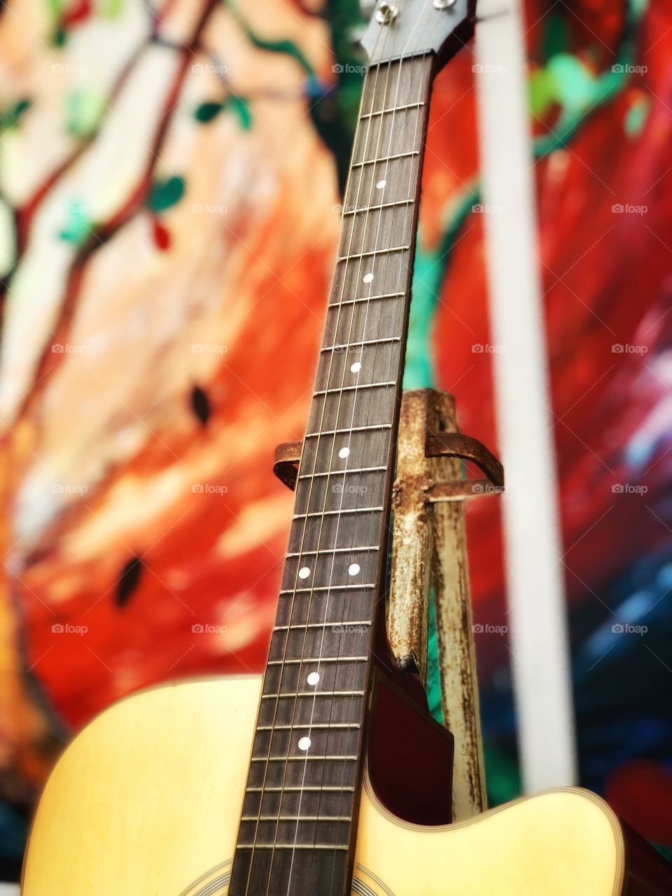 Lovely guitar against colorful background 