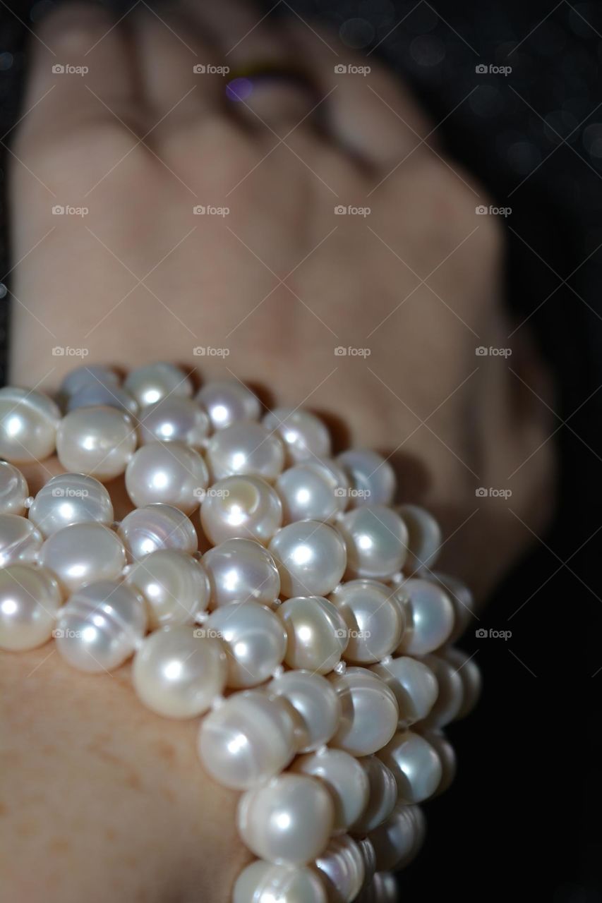 female hand with bracelet pearls beautiful accessories close up