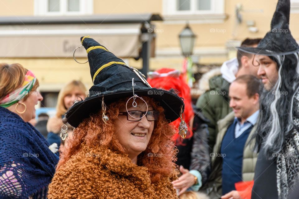 Portrait of woman dressed as a witch at carnival