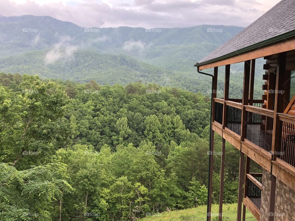 Cabin and the Smokey Mountains in Gatlinburg, Tennessee at the end of May. 