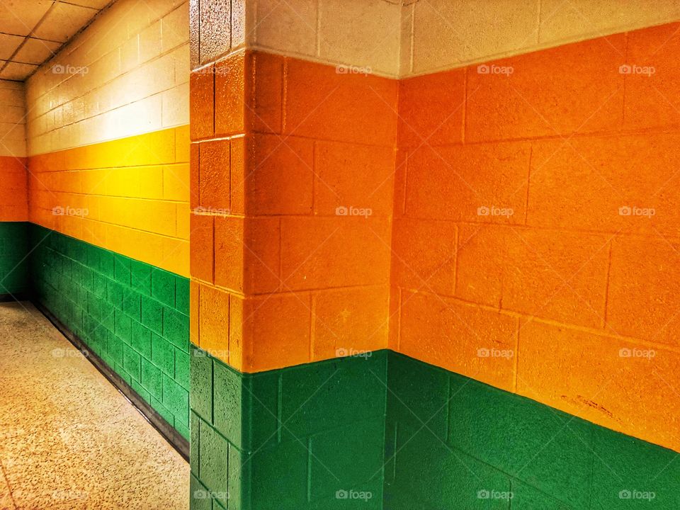 Cinder block wall painted in bright colors 