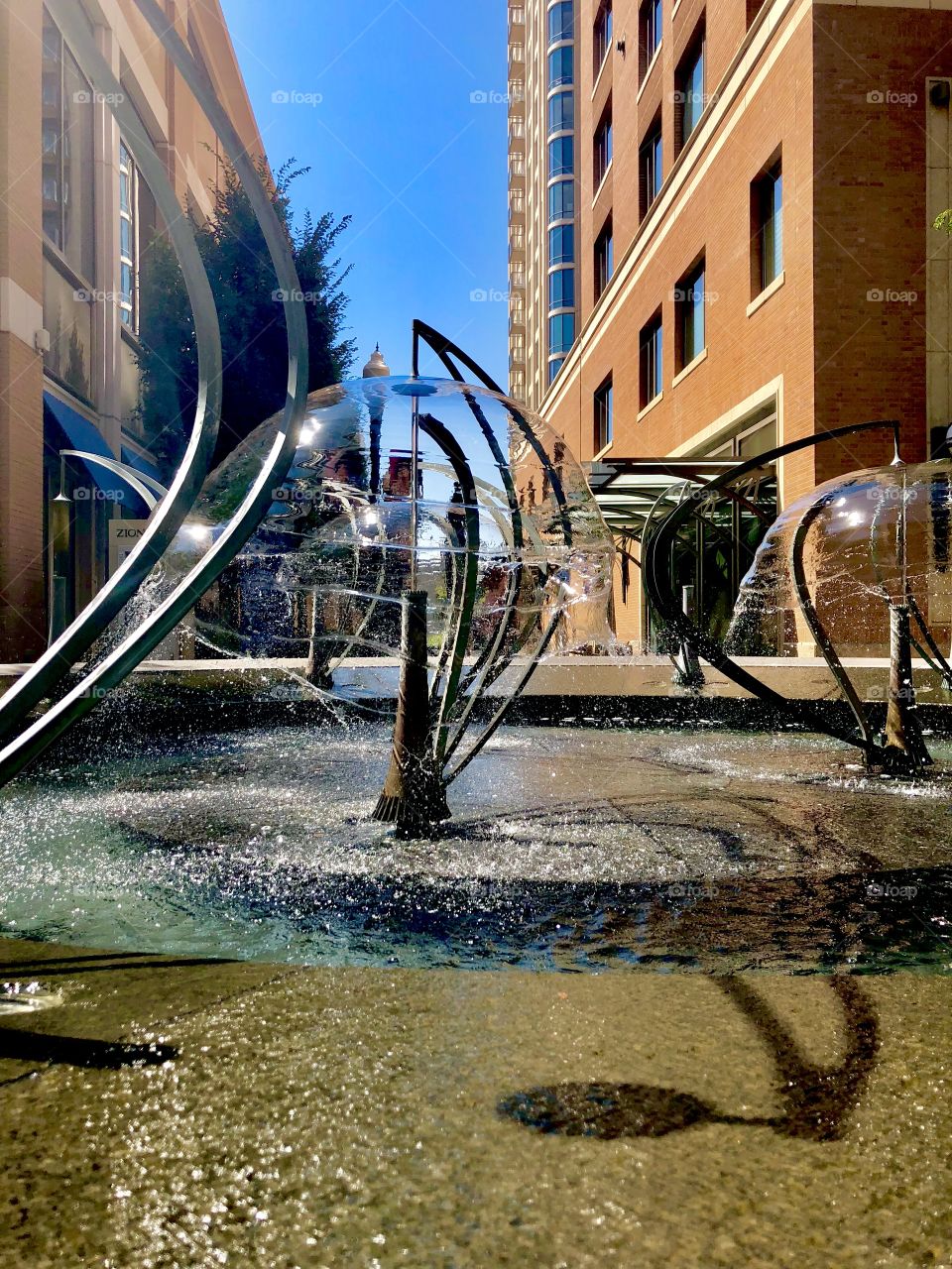 Umbrella fountain at City Creek Mall in heart of downtown Salt Lake City , UT on a sunny summer’s day.