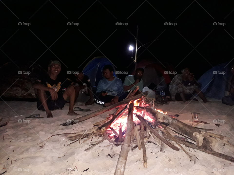 camping fire night dark sand beach