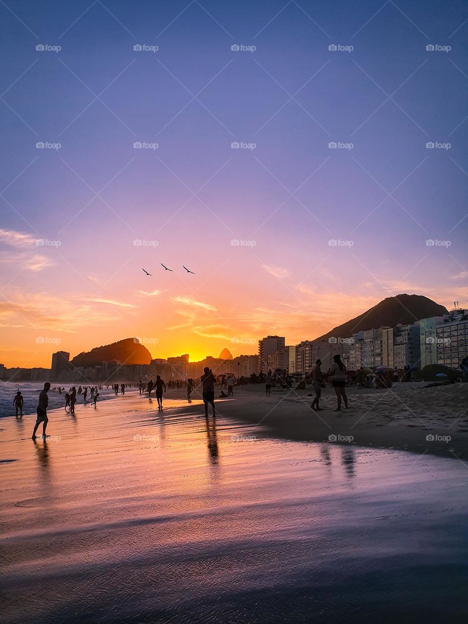 Reflections of Sunset in Copacabana Beach