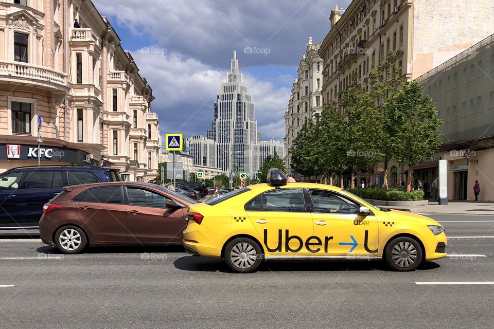 uber taxi on the city road