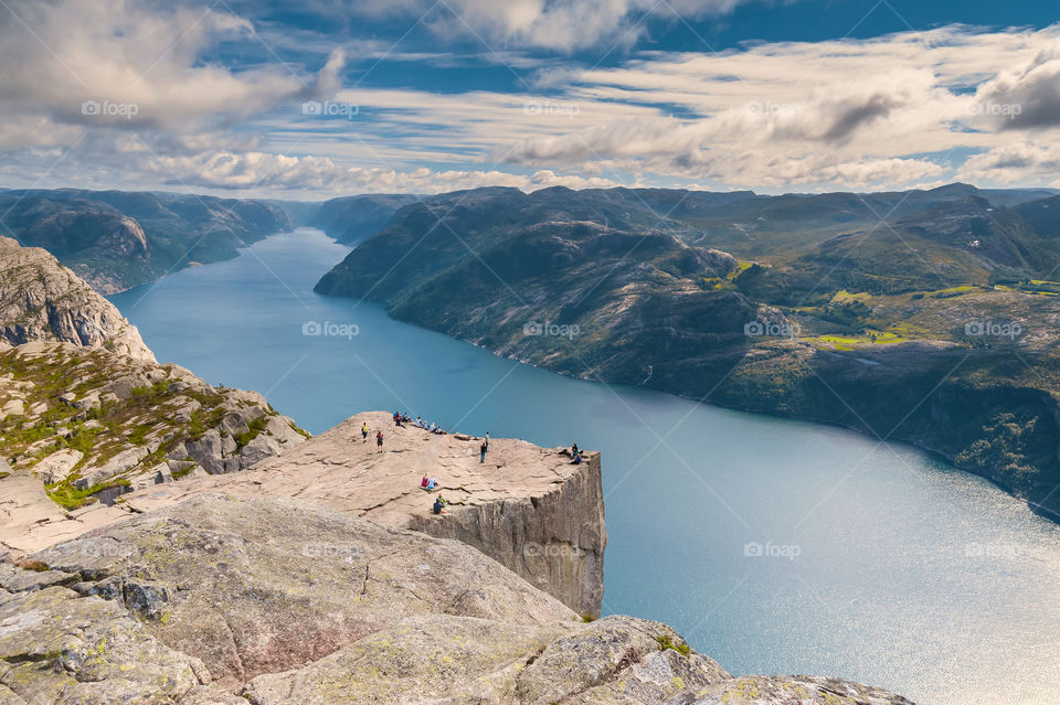 Distant view at the Preikestolen known as the Pulpit Rock with fjord  Lysefjorden. Norway. Scandinavia. Europe.