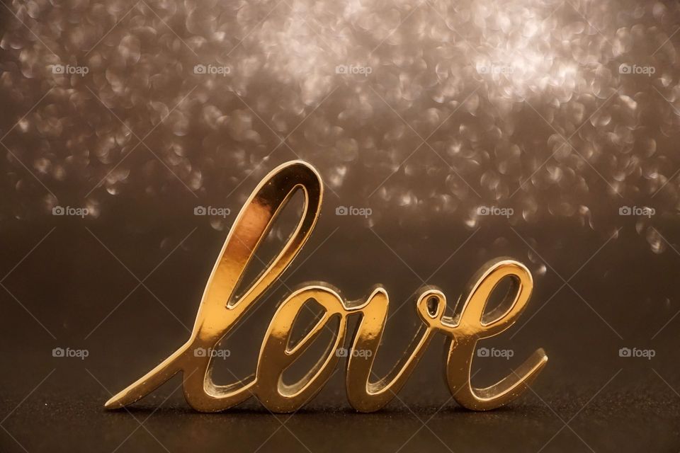 Single word love in gold