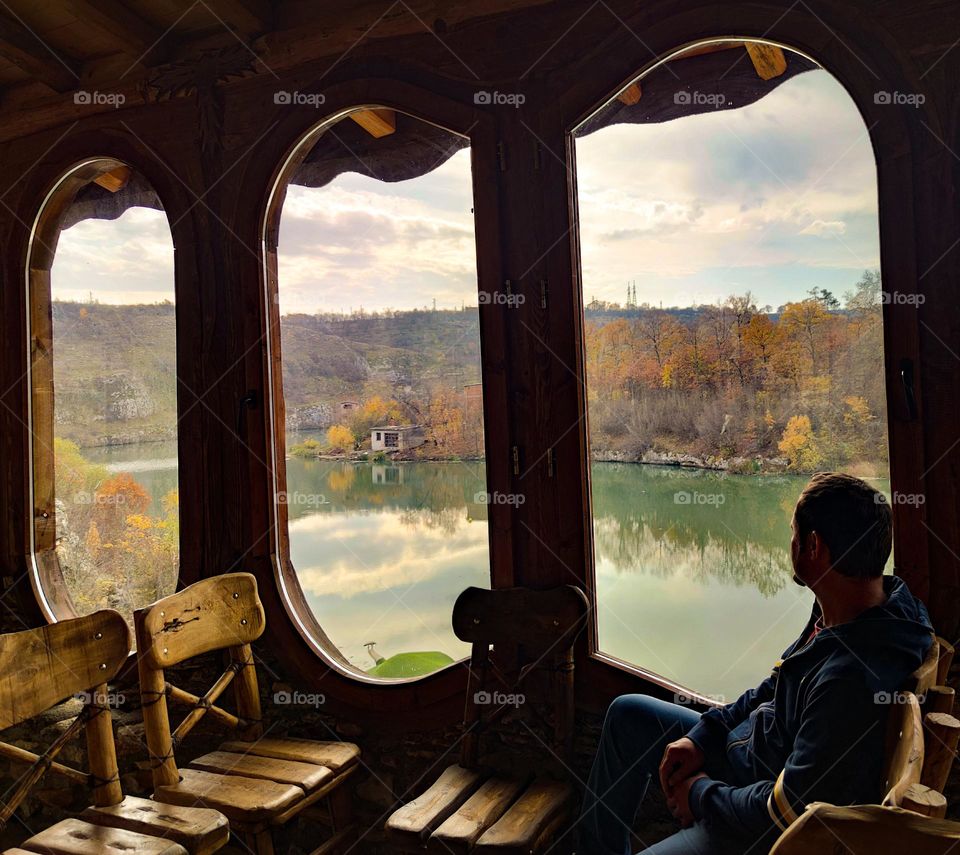 Looking through the window of a wooden house