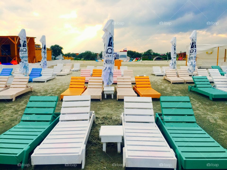 Empty beach with sun beds