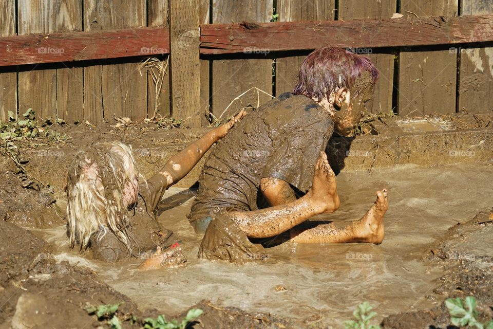 Kids Playing In Mud