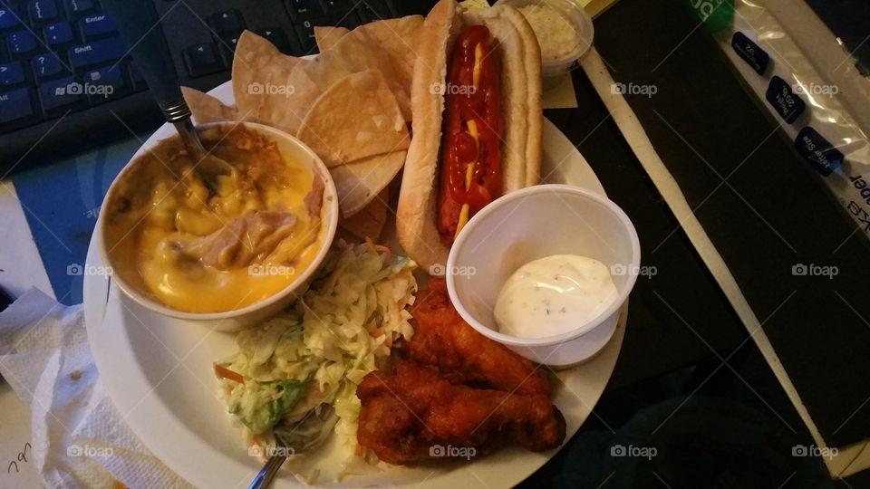 hungry man appetizer, hot dog, chicken wings, nacho and cheese with pasta