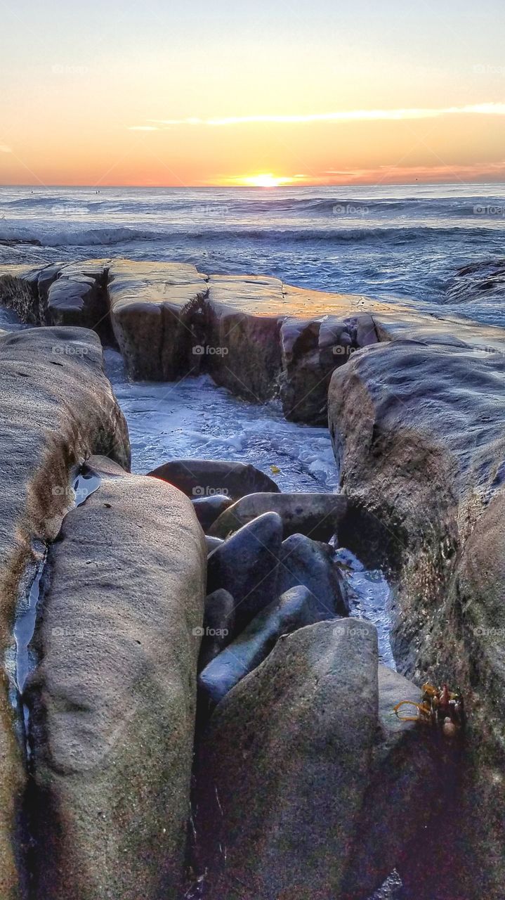 perfect sunset on rocky shores