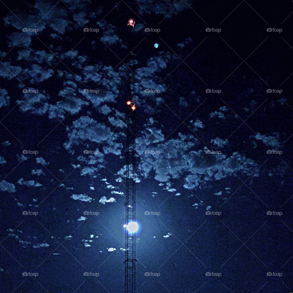 Moon shinning in the radio tower