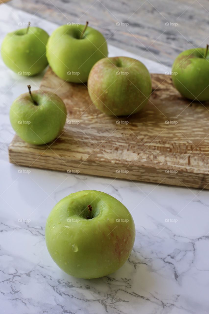 Green apples on the white background 