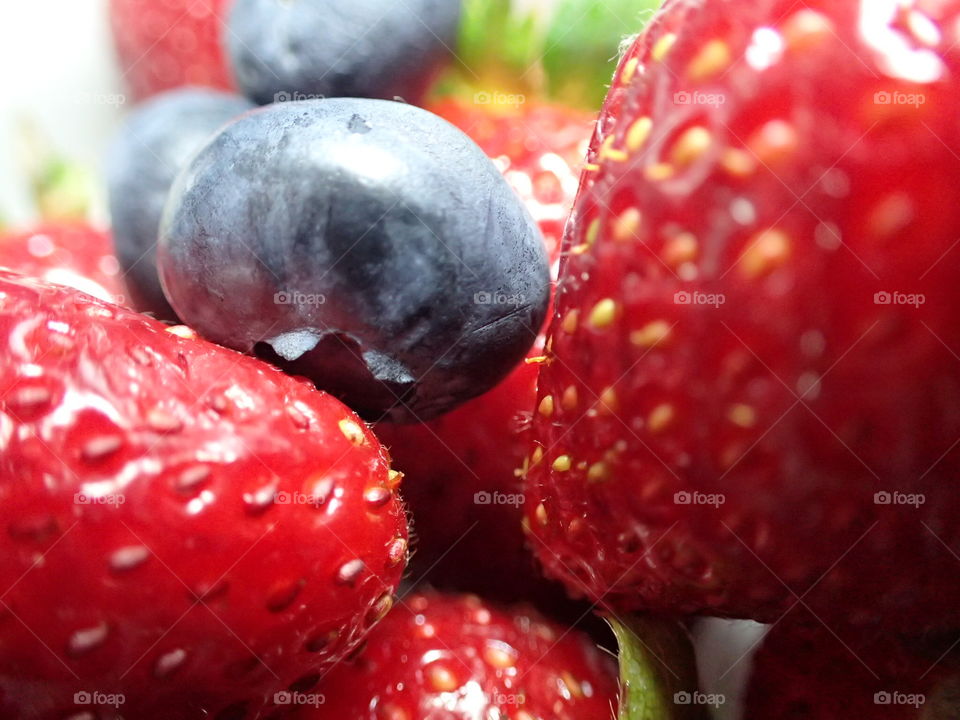Close-up of a strawberry and blueberry