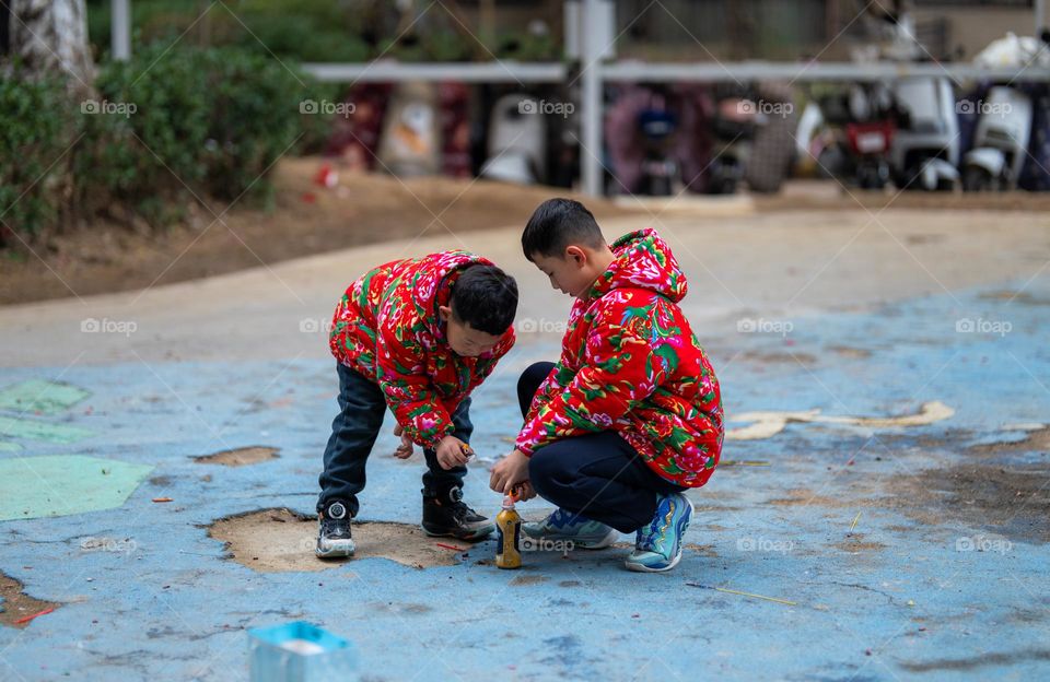 The kids setting up the firecrackers