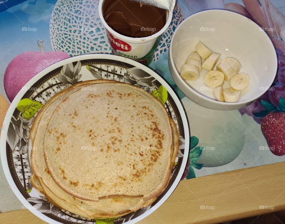 Pancakes with chocolate and bananas