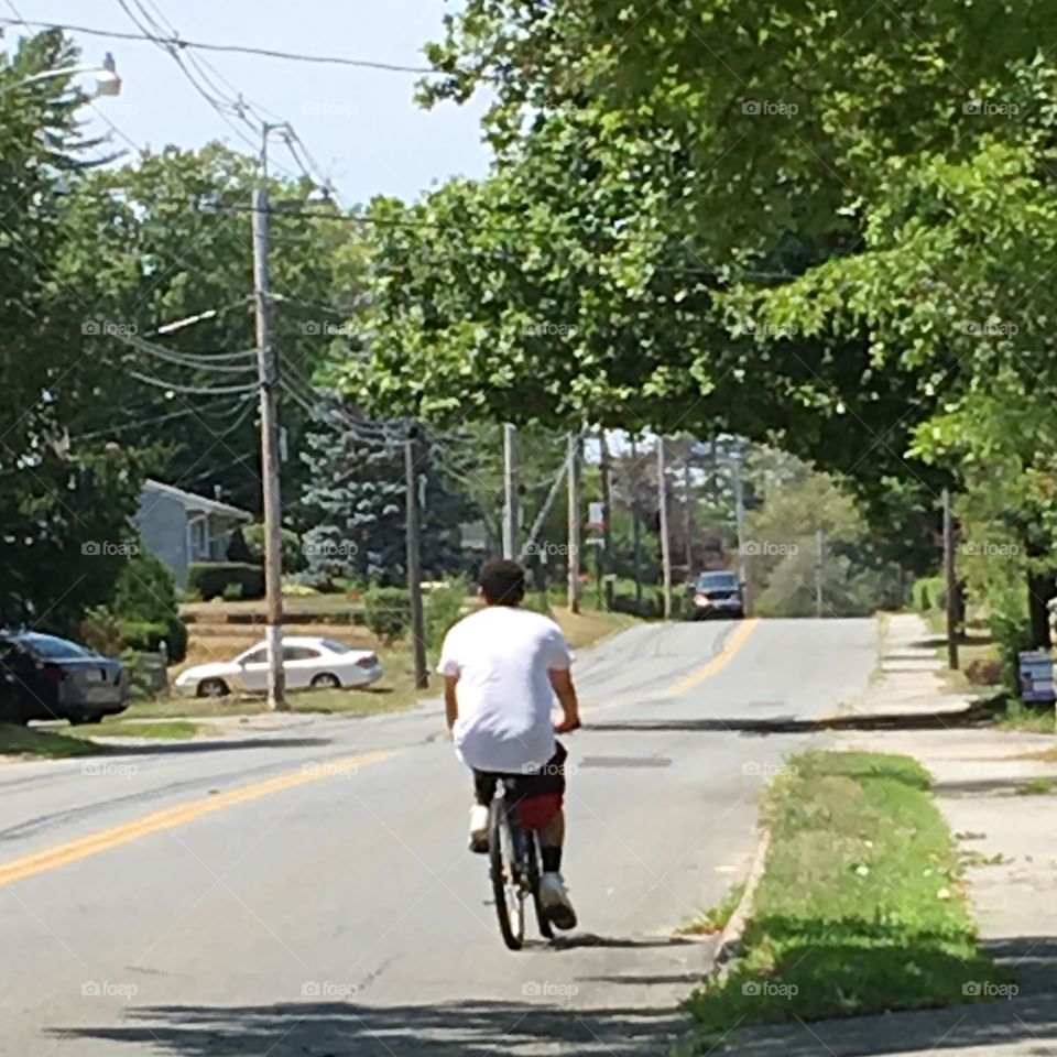 Man on bicycle🚲, faster than walking on hot day!