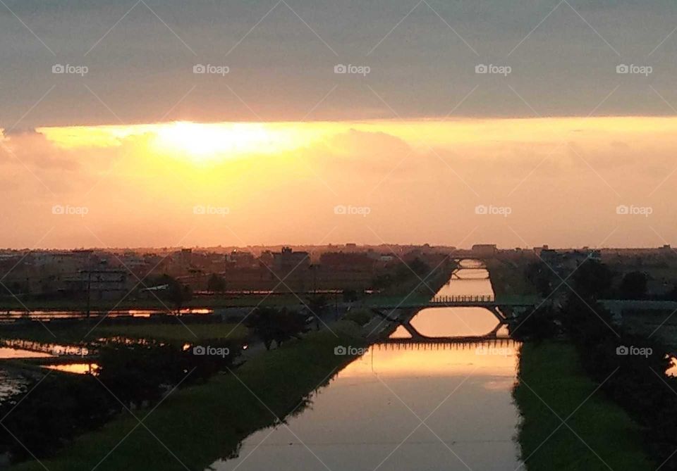 a beautiful bridge reflection at  sunrise of countryside.